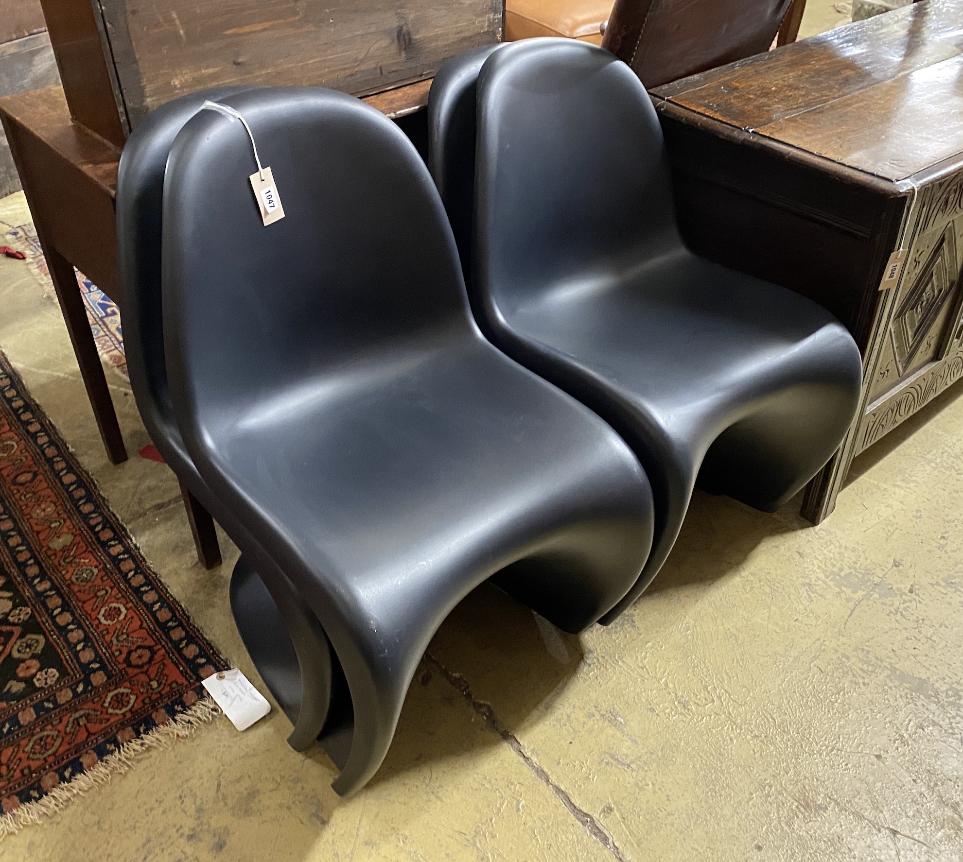 A set of four Vitra Panton chairs